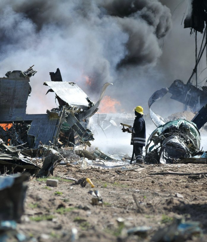 Fireman puts out fire on plane crash