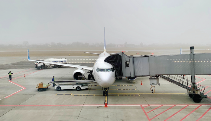 Ground crew prepare airplane at airport